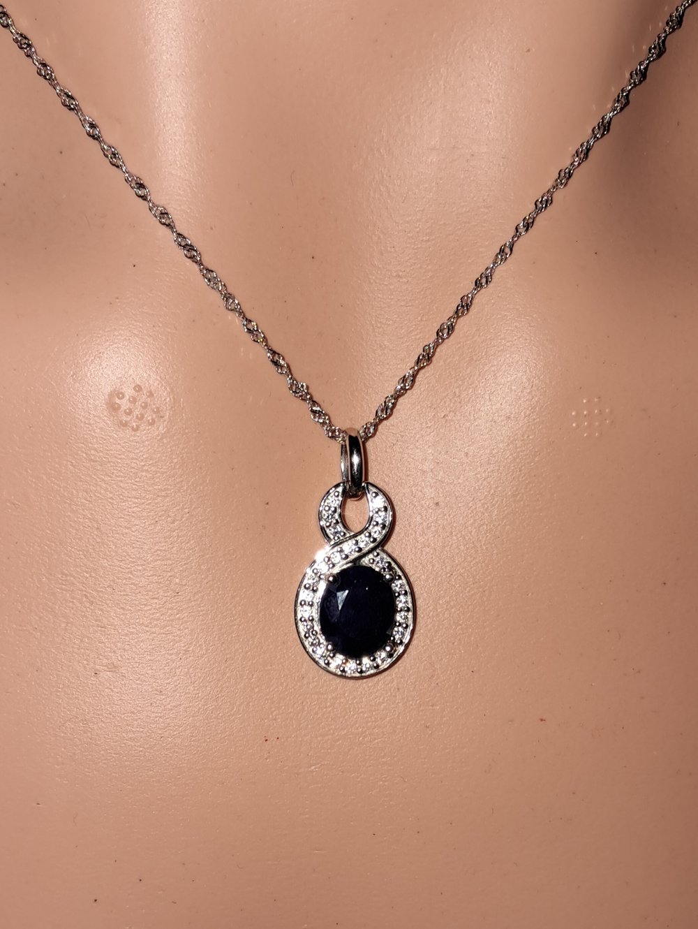 Sterling Silver Infinity Pendant Necklace with Dark Blue Stone